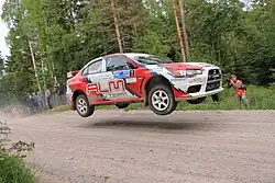Jevgenij Novikov s navigátorem Sergejem Larensem během Mistrovství Ruska v rallye v Karélii (2010)