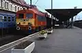 Osobní vlak s lokomotivou M41 ve stanici.
