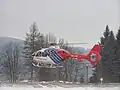 Kryštof 04 při sekundárním letu na heliportu ve Valašském Meziříčí (OK-NIK)