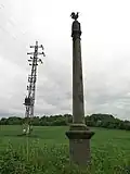 Březnice, boží muka při silnici do Hvožďan.jpg