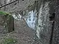 Ve skále vytesaný mlýnský výpustek Spáleného mlýna