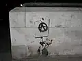 Krysa se symbolem anarchismu