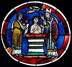 Detail vitráže: liturgický obřad křtu