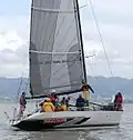 Plachta tkaná z uhlíkových vláken (v typické šedé a černé barvě), asi z roku 2006