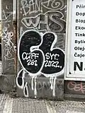 Dvoupísmenný throw up prvních dvou znaků z přezdívky „Cliff261“ nedaleko stanice metra Vltavská.