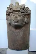 Keramická nádoba s ženskou hlavou
