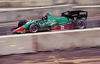 Eddie Cheever řídící vůz Alfa Romeo 184T při Grand Prix Dallasu 1984.
