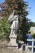 Detail_of_statue_of_John_of_Nepomuk_in_Opatov,_Třebíč_District.jpg