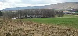 Pohled na severní část Dolních Mlýnů, dálnici D1 a Oderské vrchy (kopec Obírka)