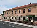 Hostinec s nápisem "Václav Matěj Žilina" provozovaný od roku 1868, ulice K Lochkovu
