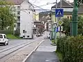 Ulice Budovatelů, před odbočením do smyčky