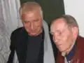 V diskusi s Januszem Głowackim (1938–2017)