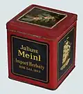 Plechovka od čaje Julius Meinl z meziválečného Polska, zboku symbol plachetnice