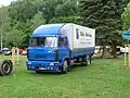 LIAZ 110.073, valník s plachtou v celní úpravě TIR