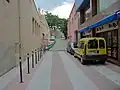 Mezinárodní silnice Rue du Petit Pont (Le Perthus, vlevo) / Carrer del Còrrec (Els Límits, vpravo)