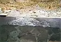 Podlahová krytina nalezená na obou stranách portikového dvora, přilehlých ke chrámu.