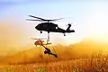 M119 v podvěsu pod UH-60 Black Hawk