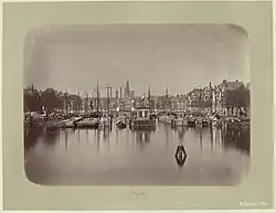 Most Magere Brug přes řeku Amstel, dekorace u příležitosti návštěvy krále Viléma III. a královny Emy v Amsterdamu, 1879