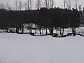 Maršovka vytvářející na svém dolním toku meandry v dolní části obce Libňatov