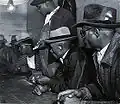 Fotografie od Marion Post Wolcott (hráči hrají o své "cotton money")