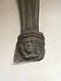 Detail konzoly ve tvaru maskaronu.