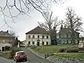 Fara na Náměstí B. Hrozného, vpravo pomník Bedřicha Hrozného