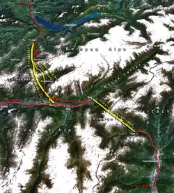 Lötschberské tunely (vlevo) a Simplonský železniční tunel, západní částí Alpského transitního projektu (žlutě: hlavní tunely, červeně: existující hlavní tratě, čísla: rok dokončení)