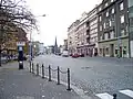 Obchodní a obytný dům firmy Svoboda (uprostřed, s dvoubarevnou fasádou)