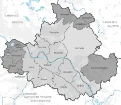 Černobílá grafika s mapou města s vyznačenými barevně rozlišenými částmi