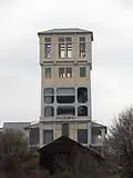 Železobetonová těžní věž dolu Kukla v Oslavanech, první věž se strojovnou v hlavě věže v Rakousku-Uhersku.