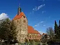 Kostel v Pechüle kombinující kamenné a cihlové zdivo