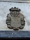 Reliéfní chronogram nad bočním vstupním portálem[1]