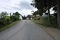 Silnice a chalupy v Račově