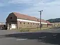Hospodářské stavení v části Drhotín