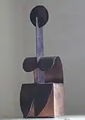 Sedící žena (měděný plech)