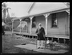 Semi-formal outdoor portrait of King George of Tonga, 86 years old, in front of the palace at Neiafu