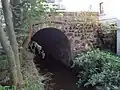 Upravené koryto Robečského potoka vedle mlýna
