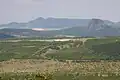Letiště na výsypce, v pozadí vrch Bořeň
