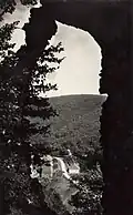 Pohled z brány umělé ruiny na Starou huť u Adamova v 1. polovině 20. století