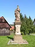 Socha sv. Jáchyma za kostelem v Radimi