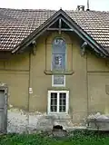 Domovní štít s mlynářským znakem