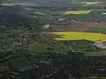 Tužín s Podhájím z letadla, v pozadí Dolánky a Dřevěnice