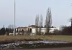 Národní centrum zemědělského a potravinářského výzkumu v Praze-Ruzyni; pohled od nádraží Praha-Ruzyně