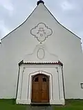 Západní portál a sakristie