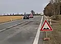 Silnice I. třídy č. 20 vedle vesnice