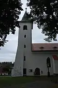 Kostel sv. Jana Křtitele v Záblatí s věží a gotickým portálem