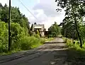 Silnice do Zbraslavic s mostem před Skalici