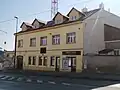 Dům (r. 2025), kde Vosmíkovi provozovali řeznictví, Zenklova 291/113, Praha 8 - Libeň