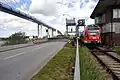 Nový a starý silniční a železniční most na Rujánu